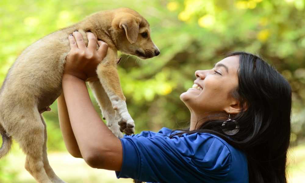 A person holding an animal